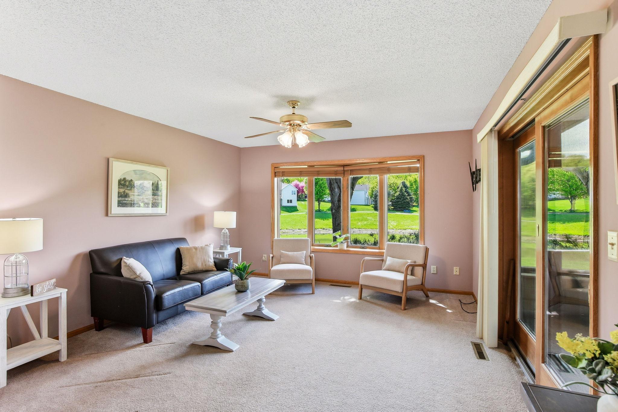 Sunroom with Bay Window & Peaceful Pond Views.