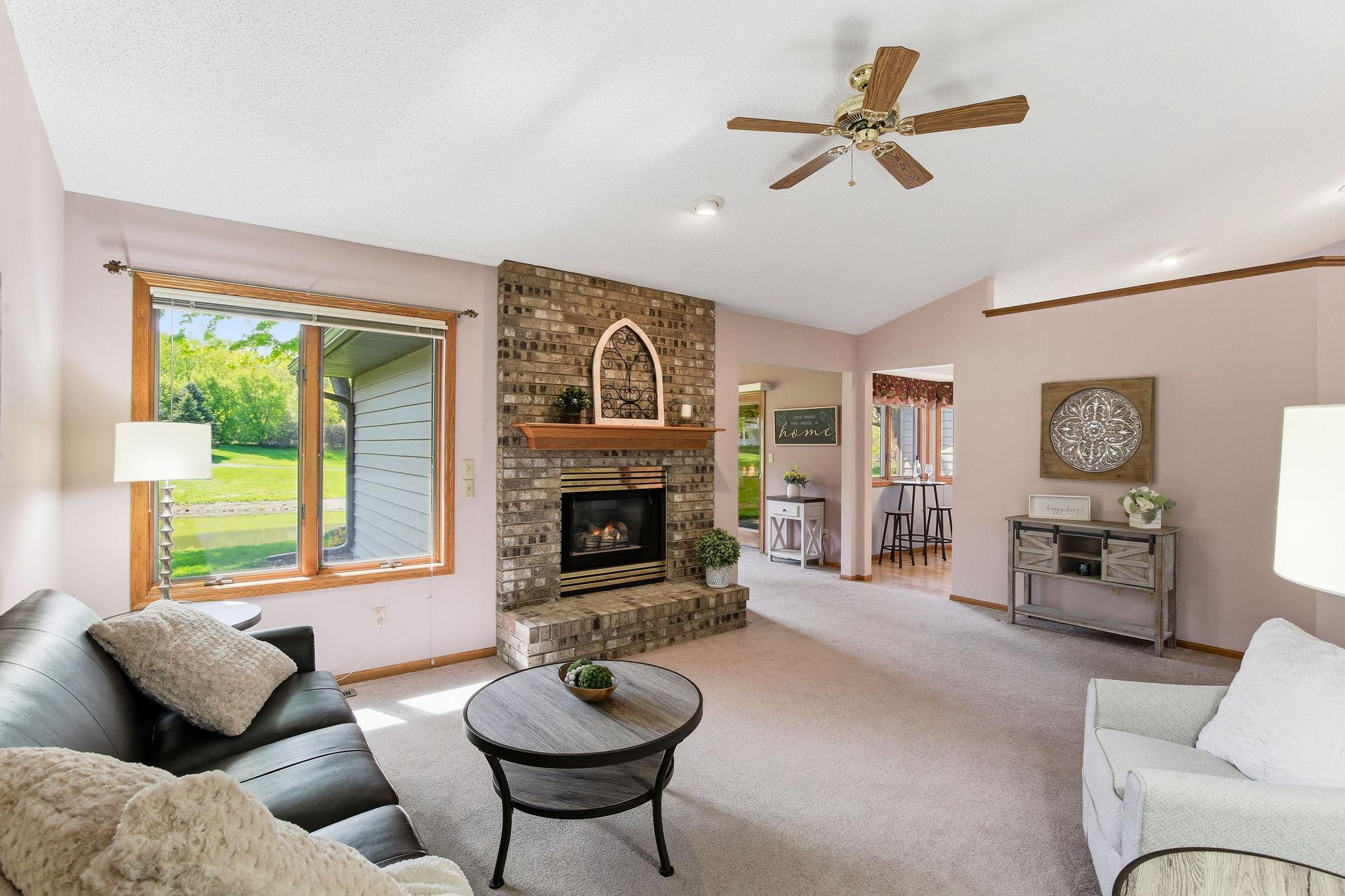 Open Vaulted Layout Connecting the Living Room, Sunroom & Kitchen.