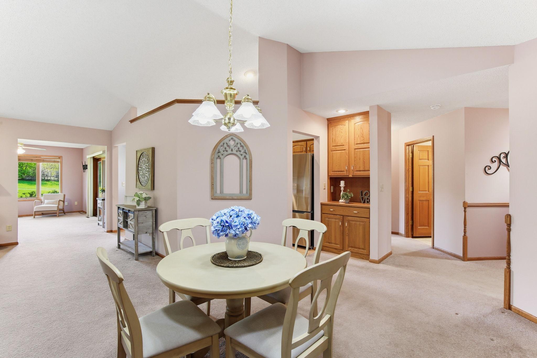 Vaulted Dining Room Open to the Kitchen & Sunroom. Don't miss the Built-in Hutch.