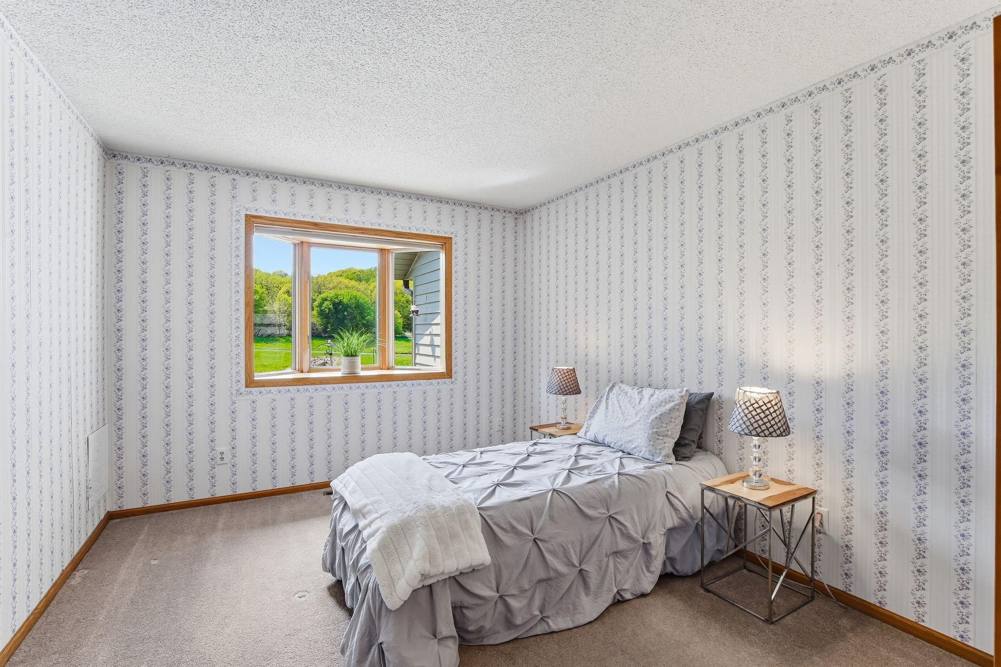 Guest Bedroom with Bay Window & Walk-In Closet.