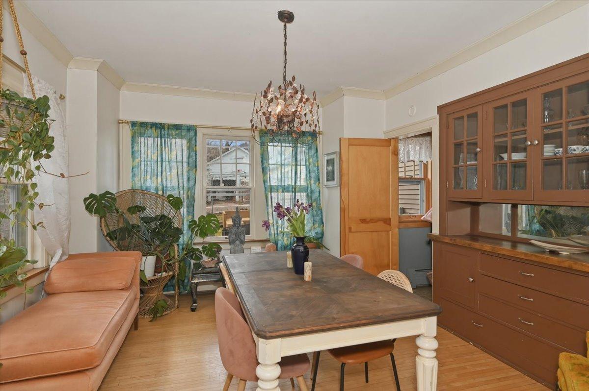 Dining room with built-in buffet, crown molding and hardwood floors.