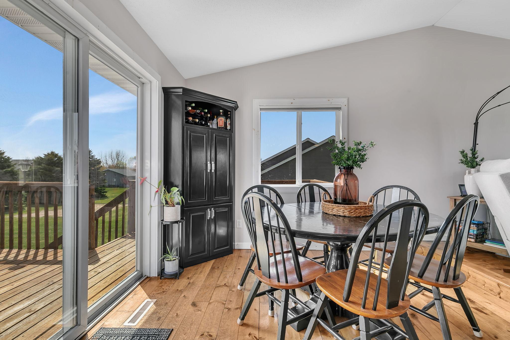 Easy flow from the dining to the deck - perfect for summer grill outs. You'll love the natural light