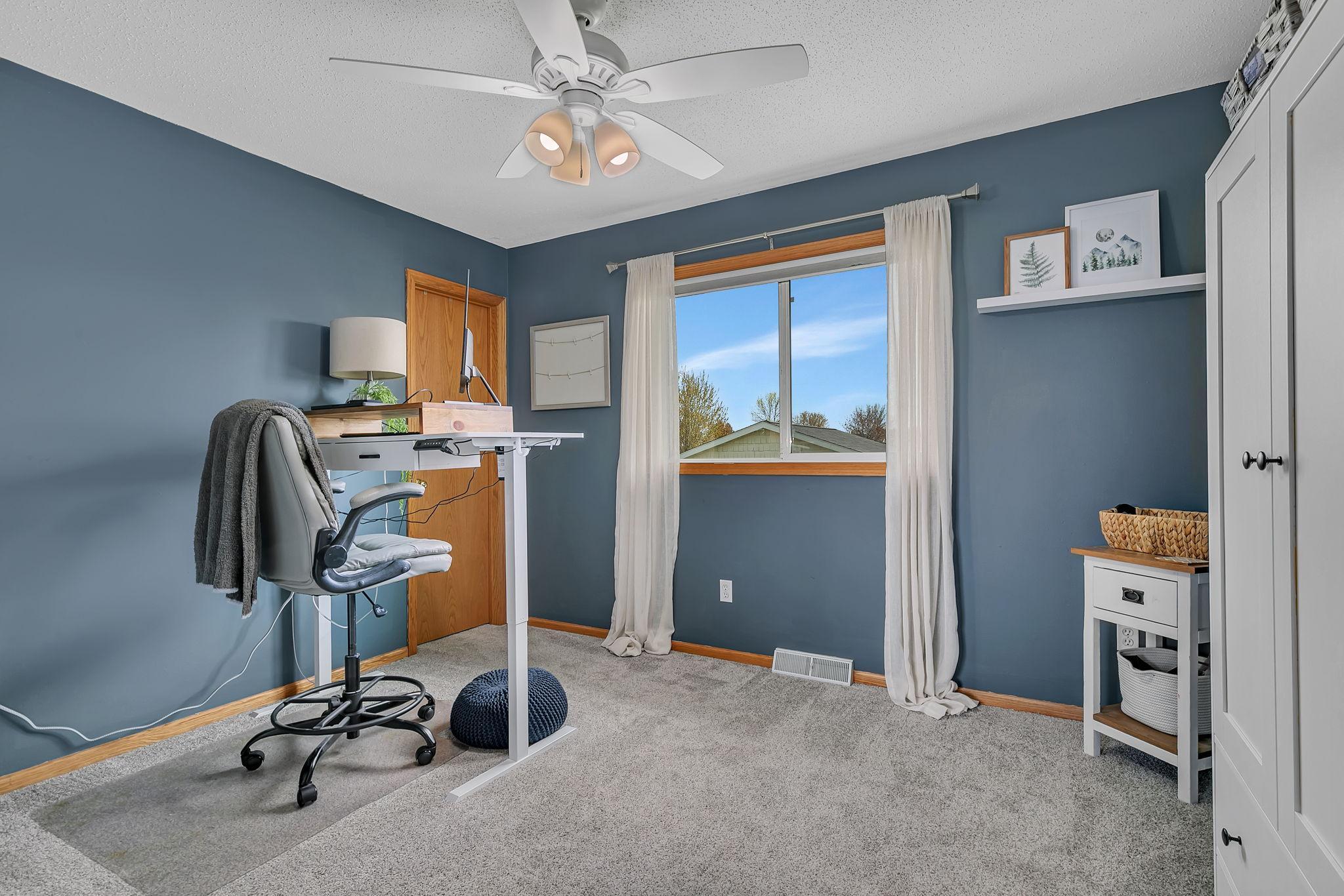 Second bedroom on the upper level with walk-in closet - currently used as home office
