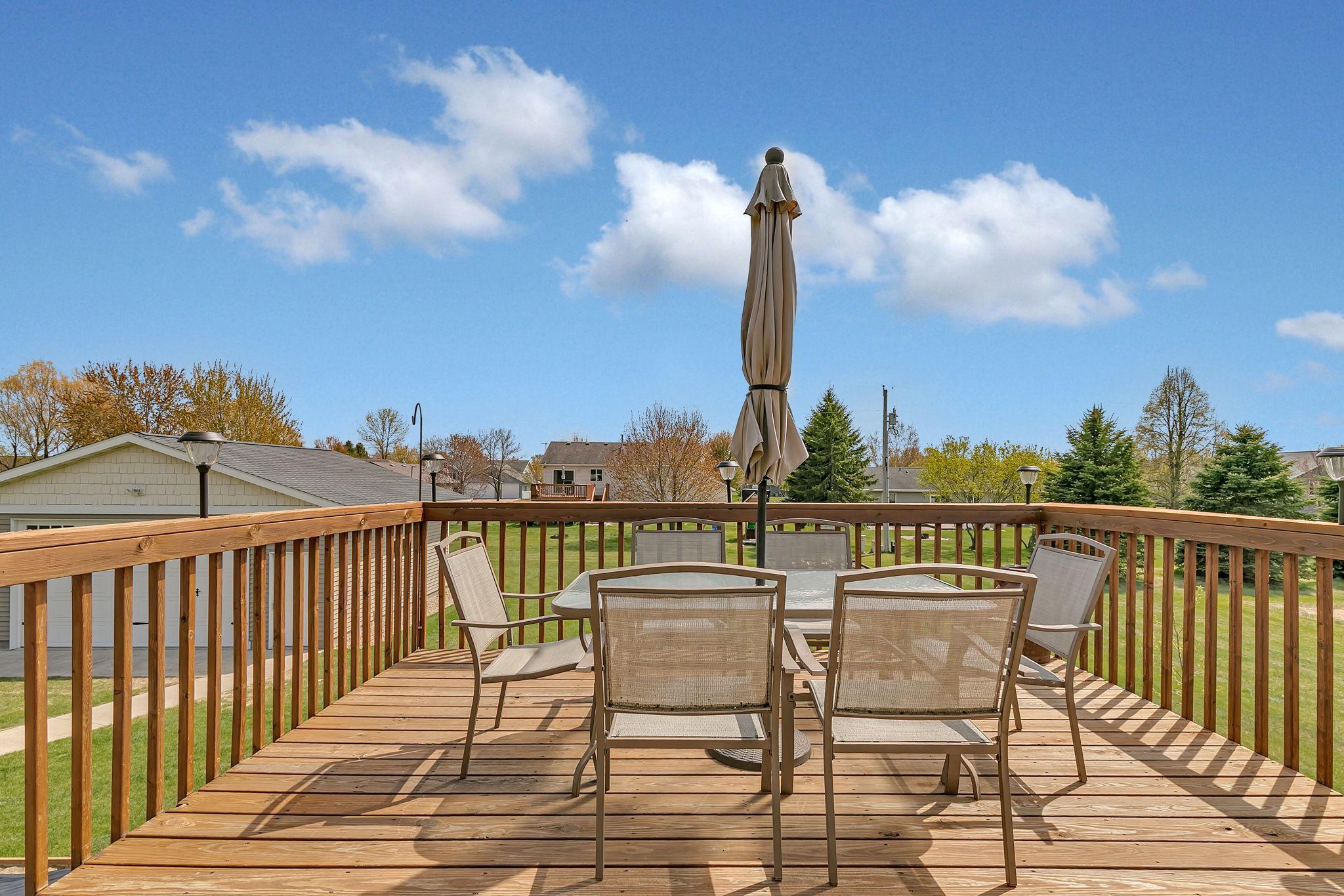 14x13 deck with stairs down to the yard + an extra 11x6 on the side of the home perfect for your grill or a cozy chair to lounge in the sun