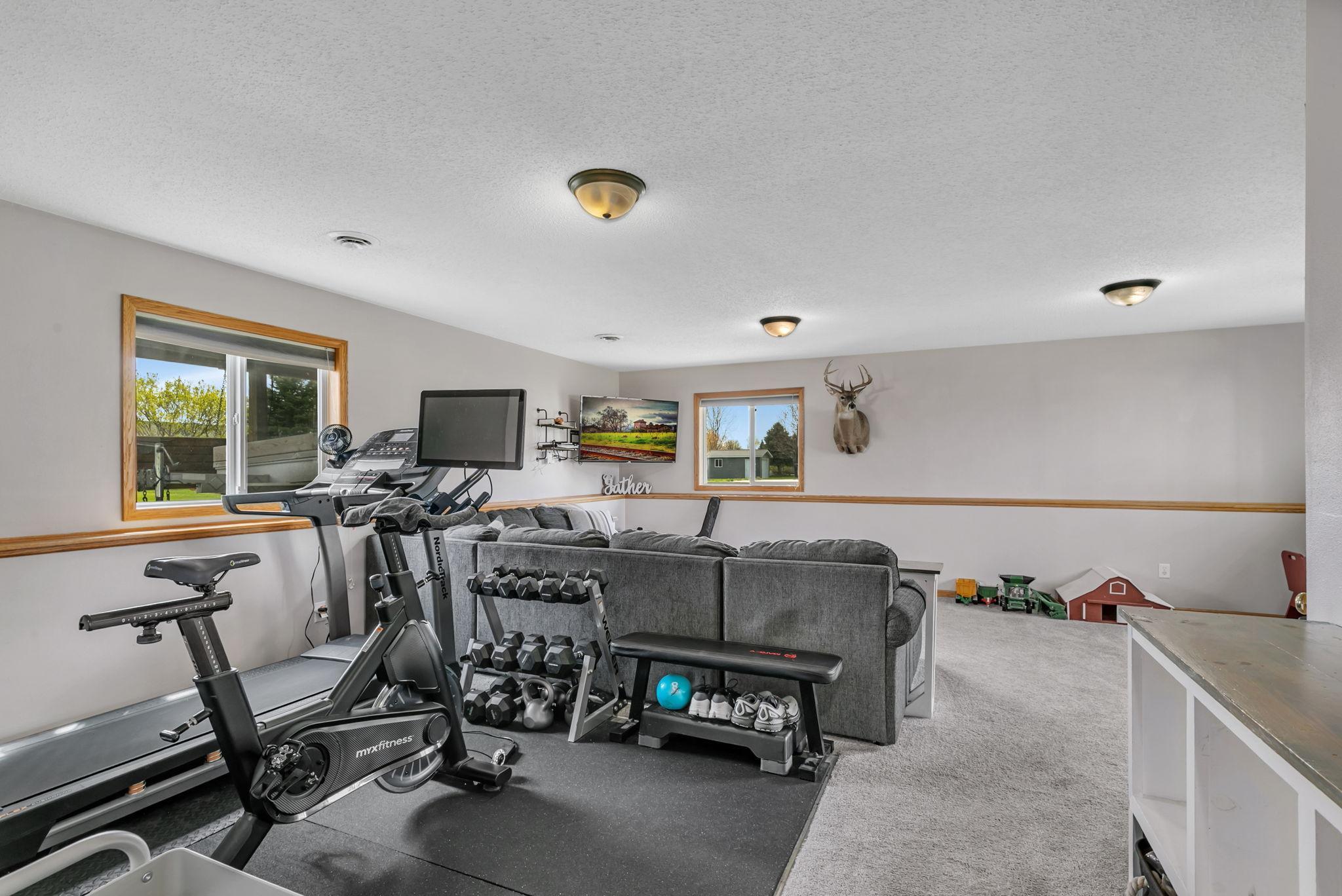 This gym space could easily serve as a home office, play room area, hobby space - the options are endless