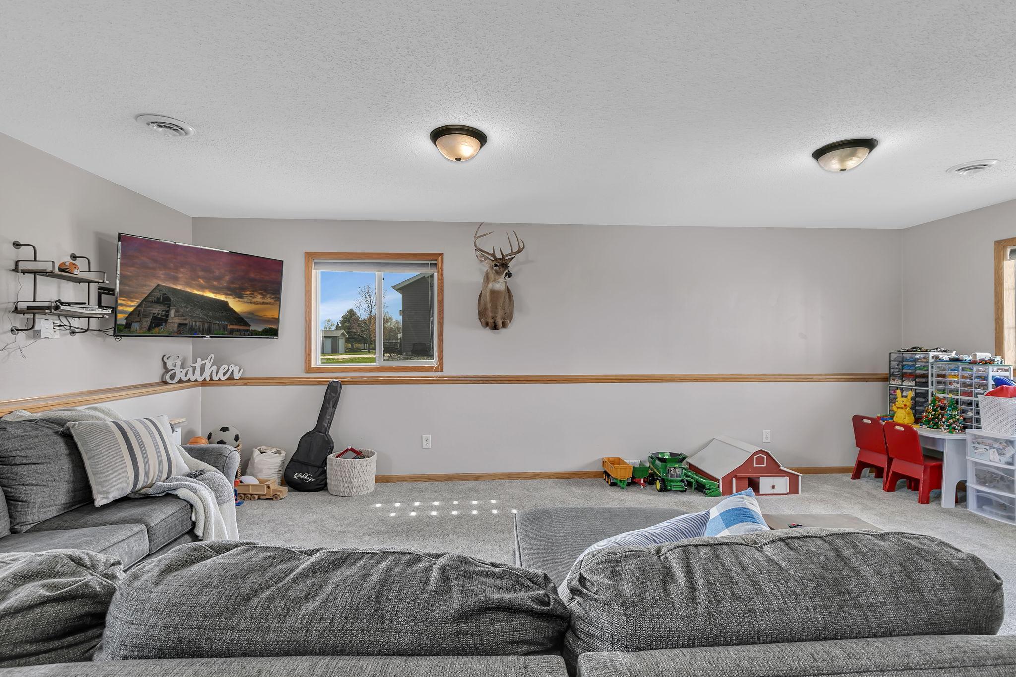 The space accomadates a huge sectional and still has plenty of room!