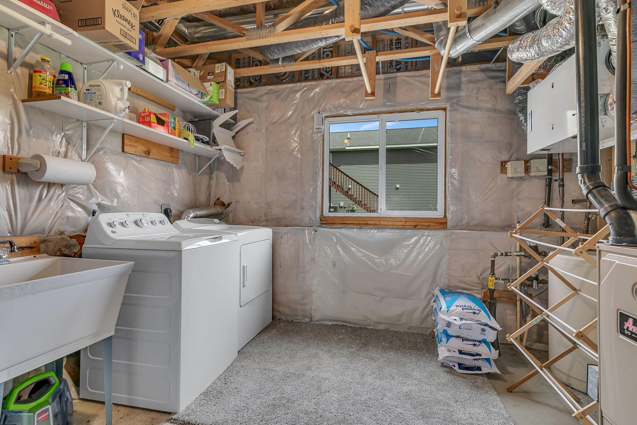 Spacious laundry room with wash tub