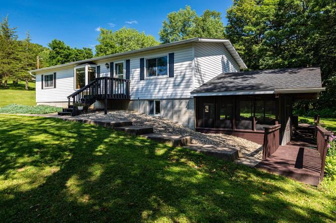 Side exterior with screened in porch