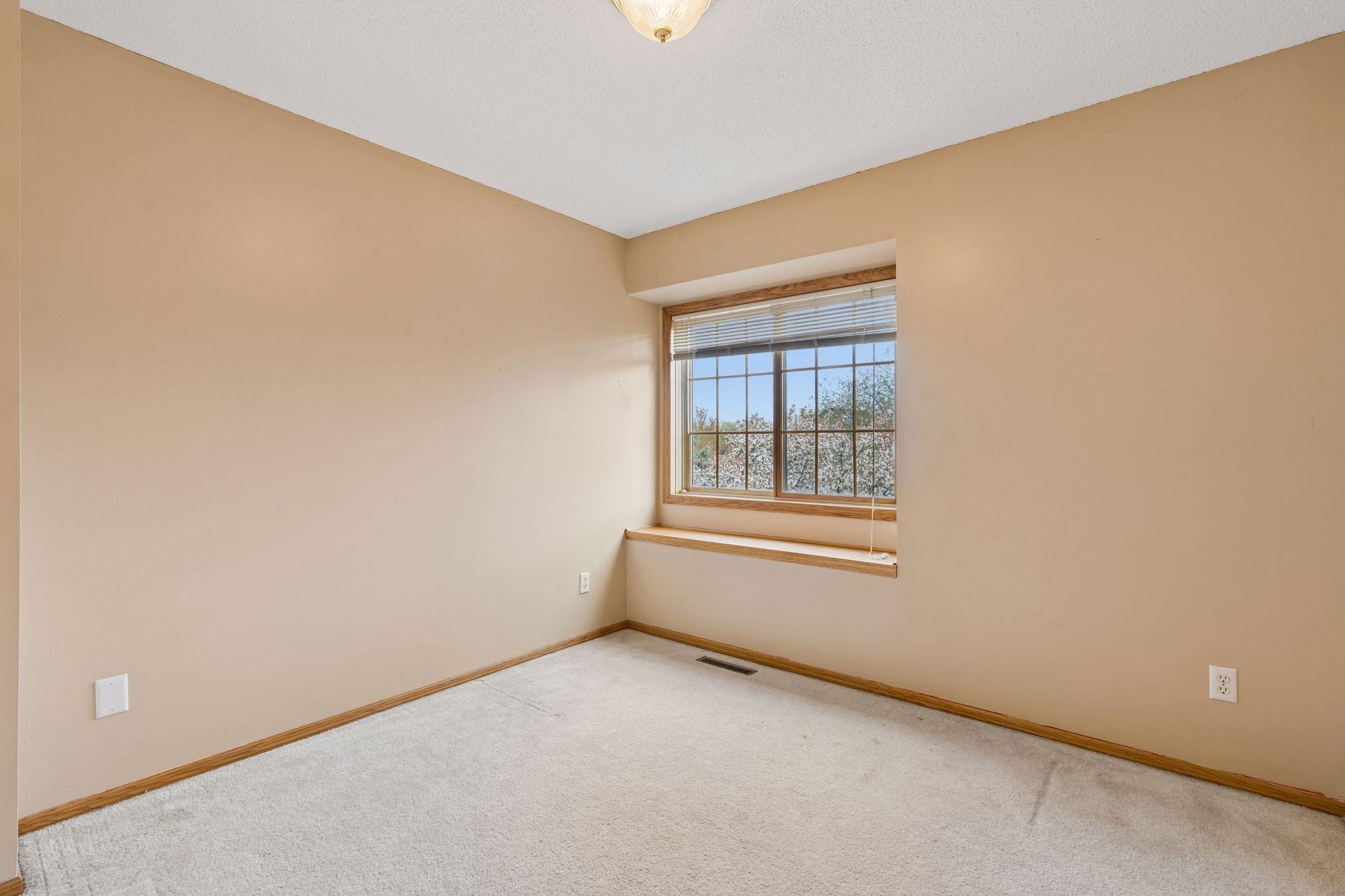 One of the additional two upper level bedrooms.