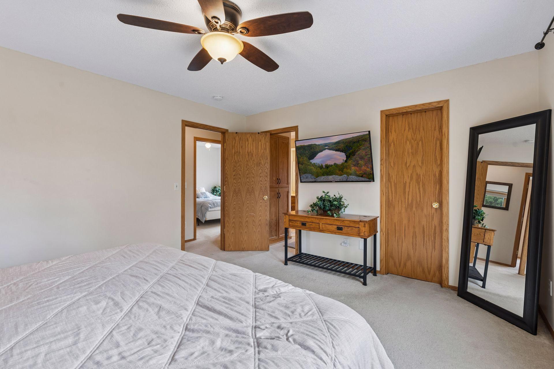 Primary bedroom features large walk in closet and walk through to full bath.
