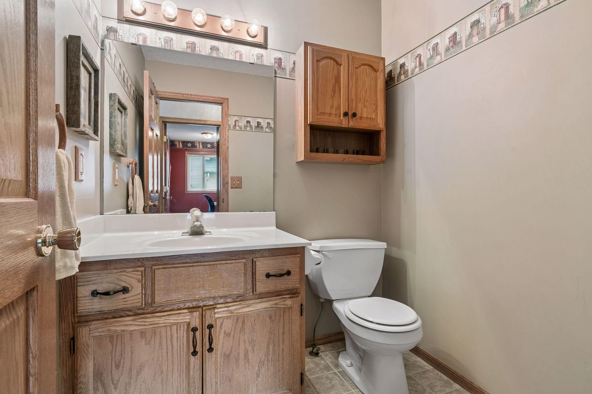 Convenient main level half bath located near the main living spaces and office.
