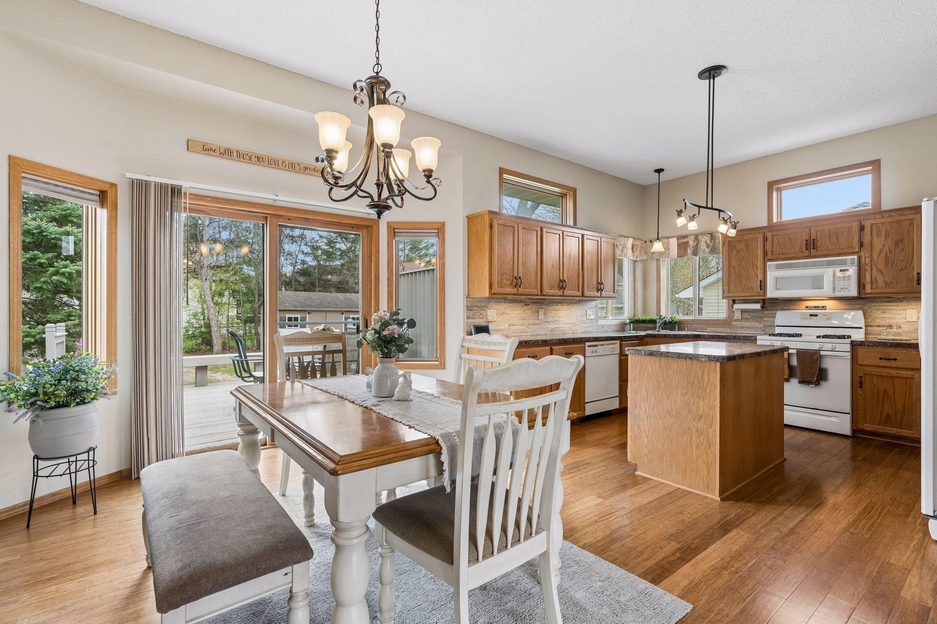 Bright kitchen featuring transom windows above the cabinets.