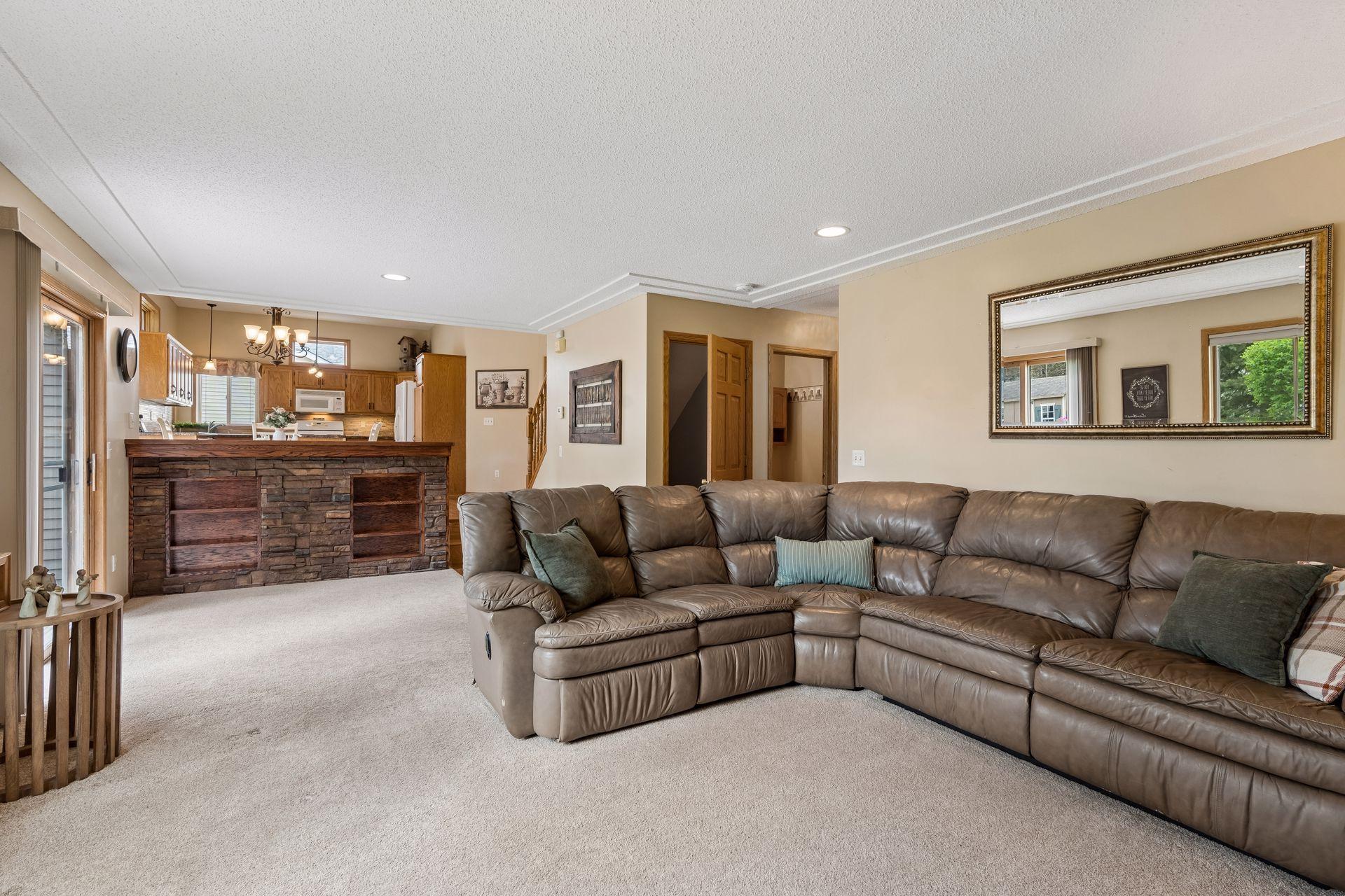 Spacious family room with elegant tray ceiling detail, open sightlines to the kitchen, and plenty of room for everyday living or entertaining.