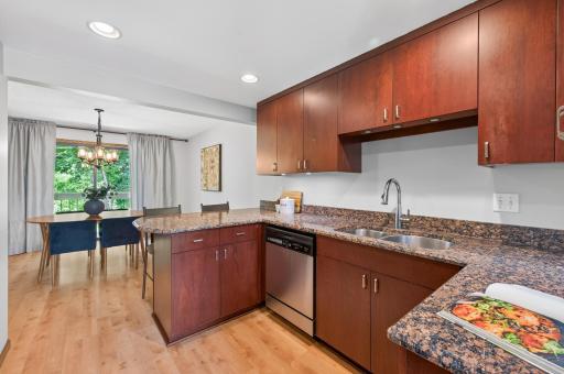 Granite countertops and stainless steel appliances.