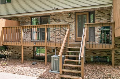 Front deck with sliding door off dining room and front door.