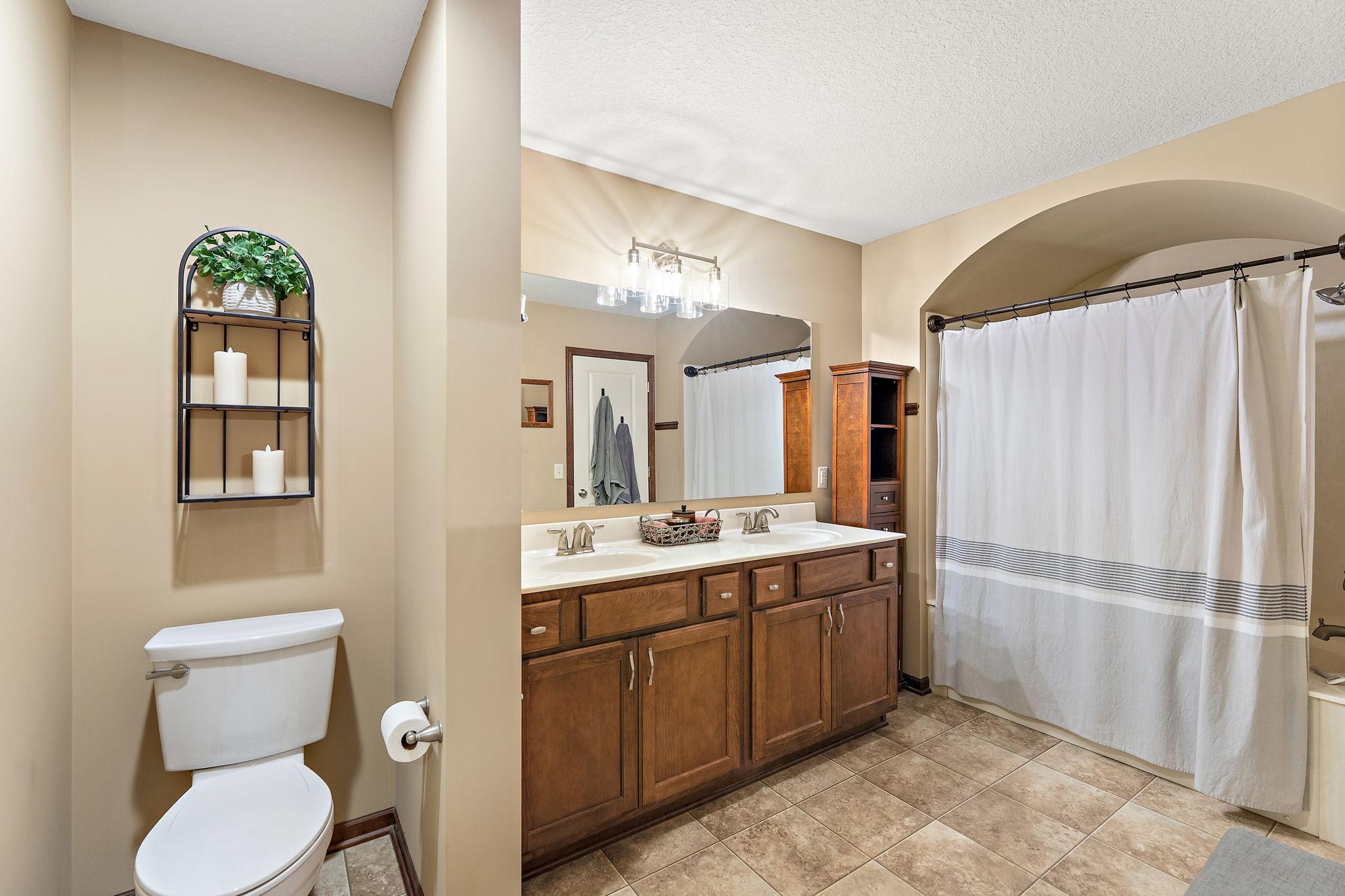 Large primary bathroom with double sinks.