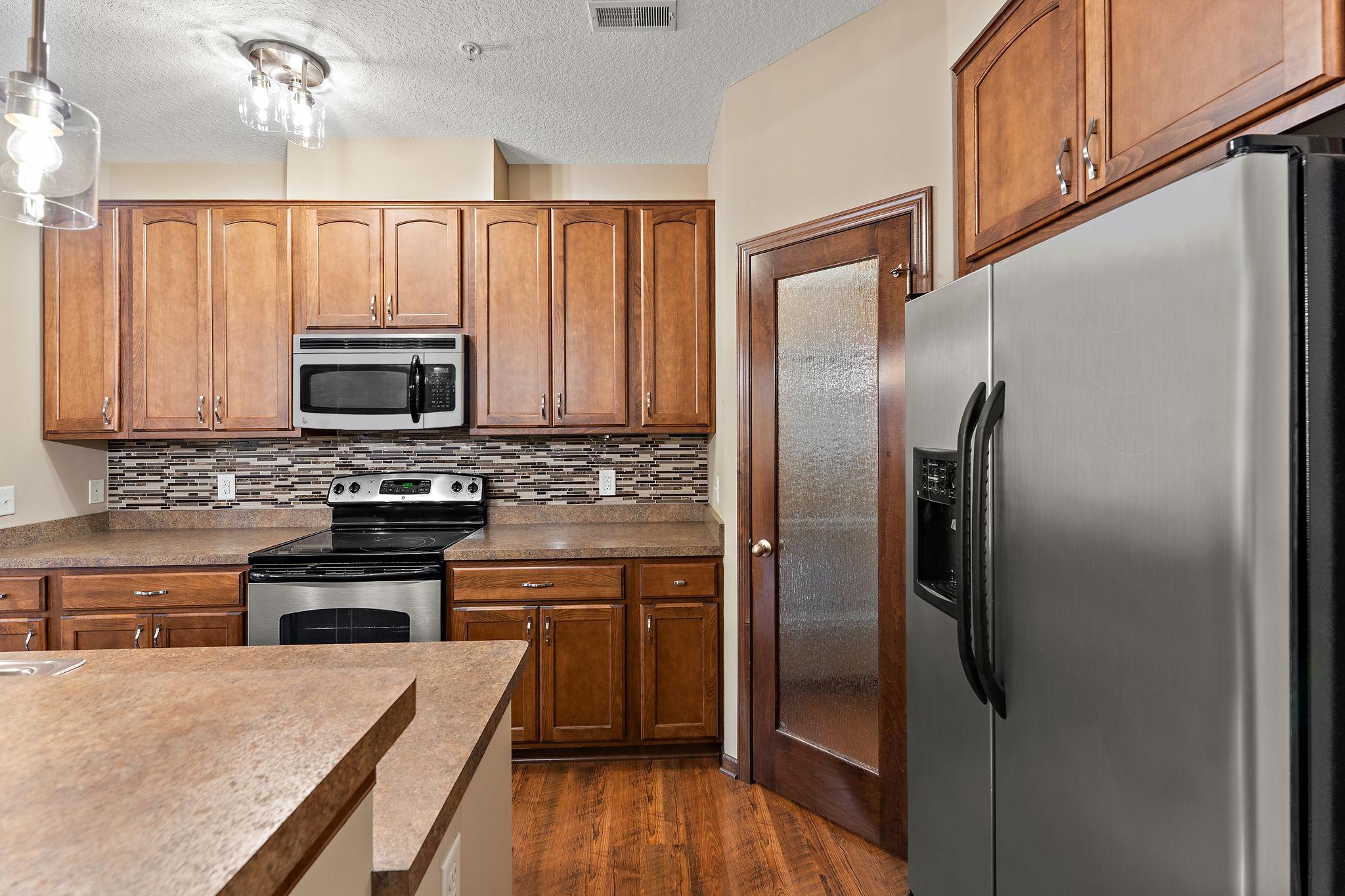 Pantry with beaded glass door.