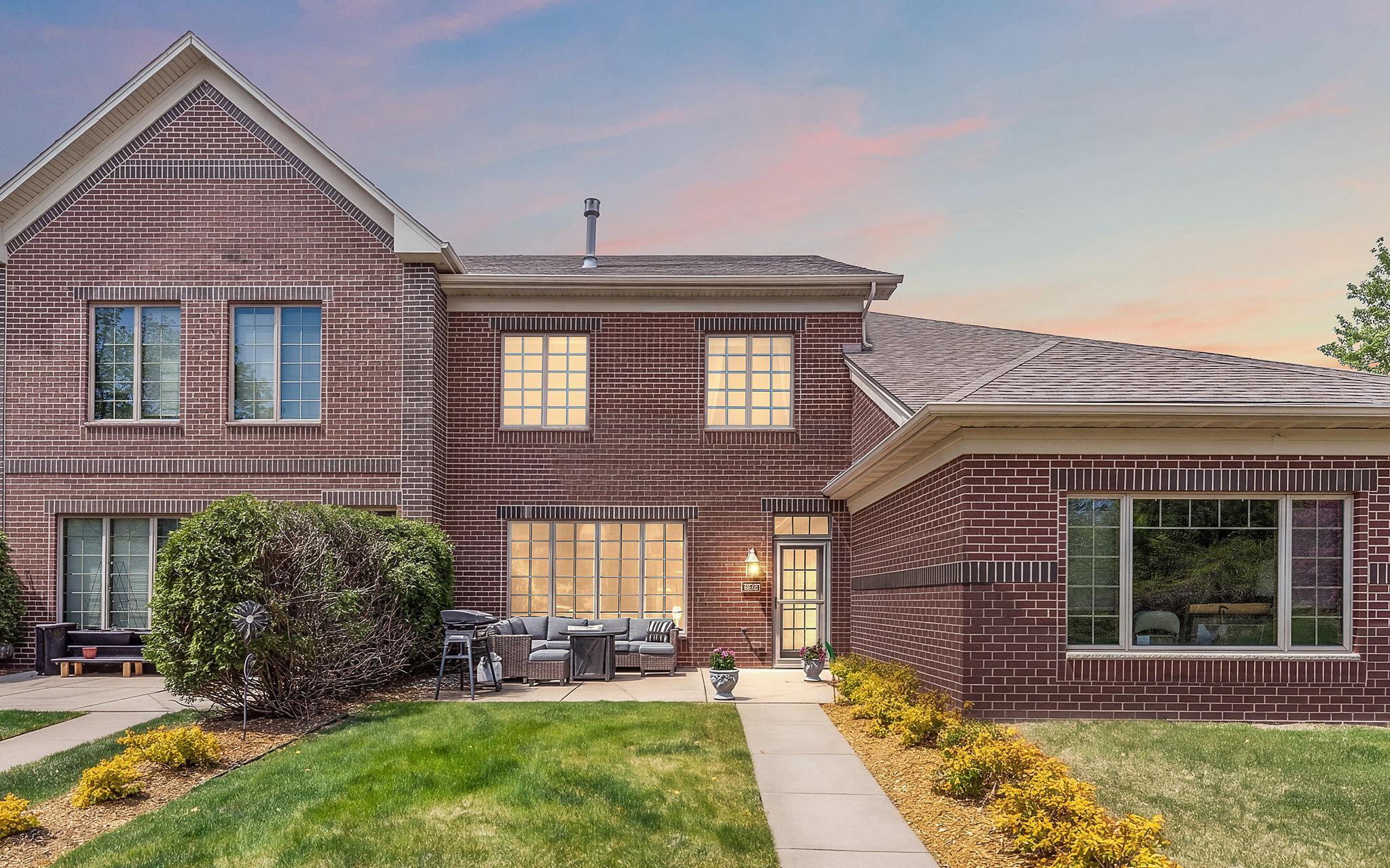 Welcome home! 12449 Flanders Ct G is a beautiful bring 2 story TH in the Lakes Neighborhood in Blaine