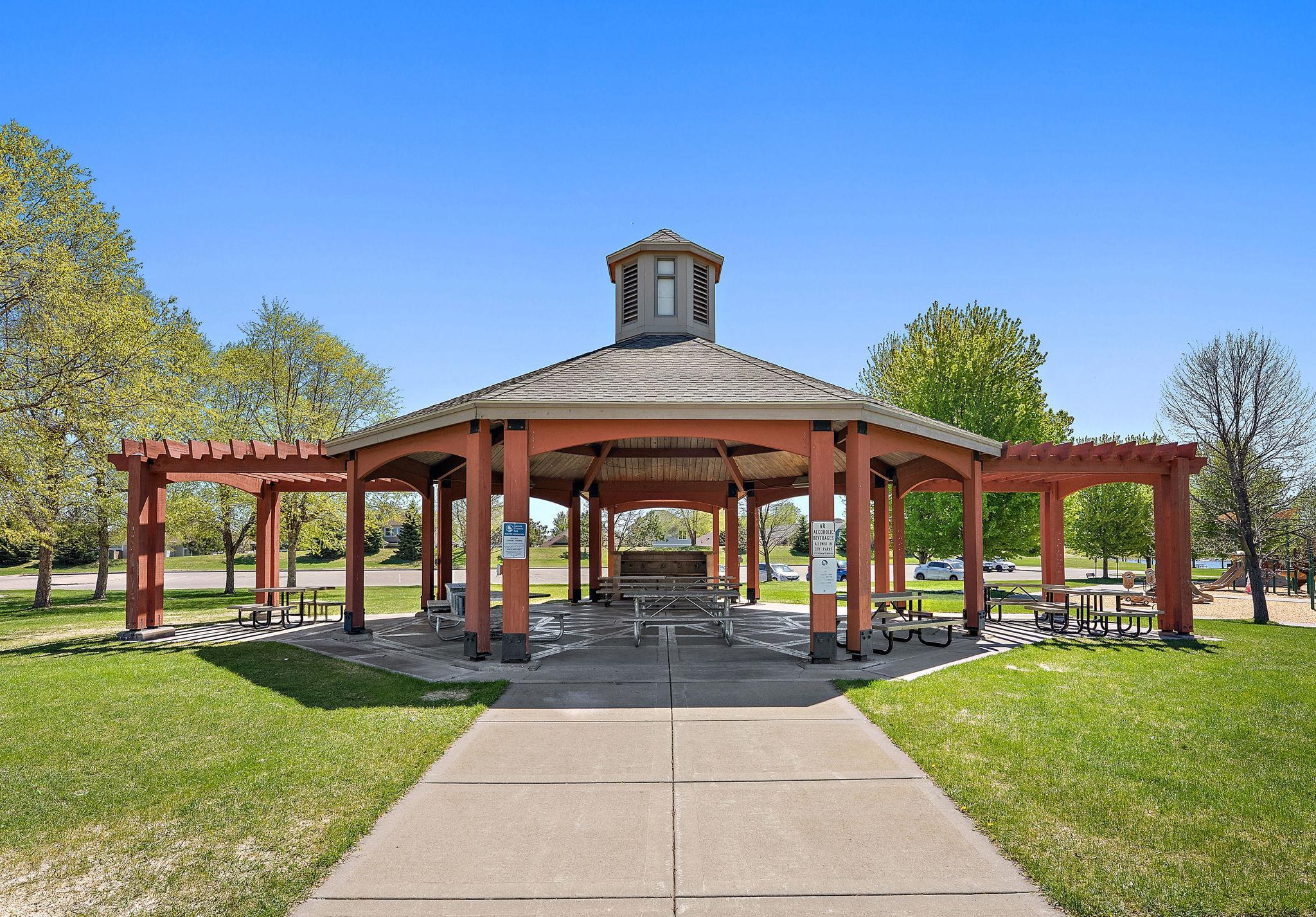 A large, attractive gazebo/pavilion serves as the park's centerpiece. It features a permanently affixed grill & plenty of picnic tables underneath for shade.
