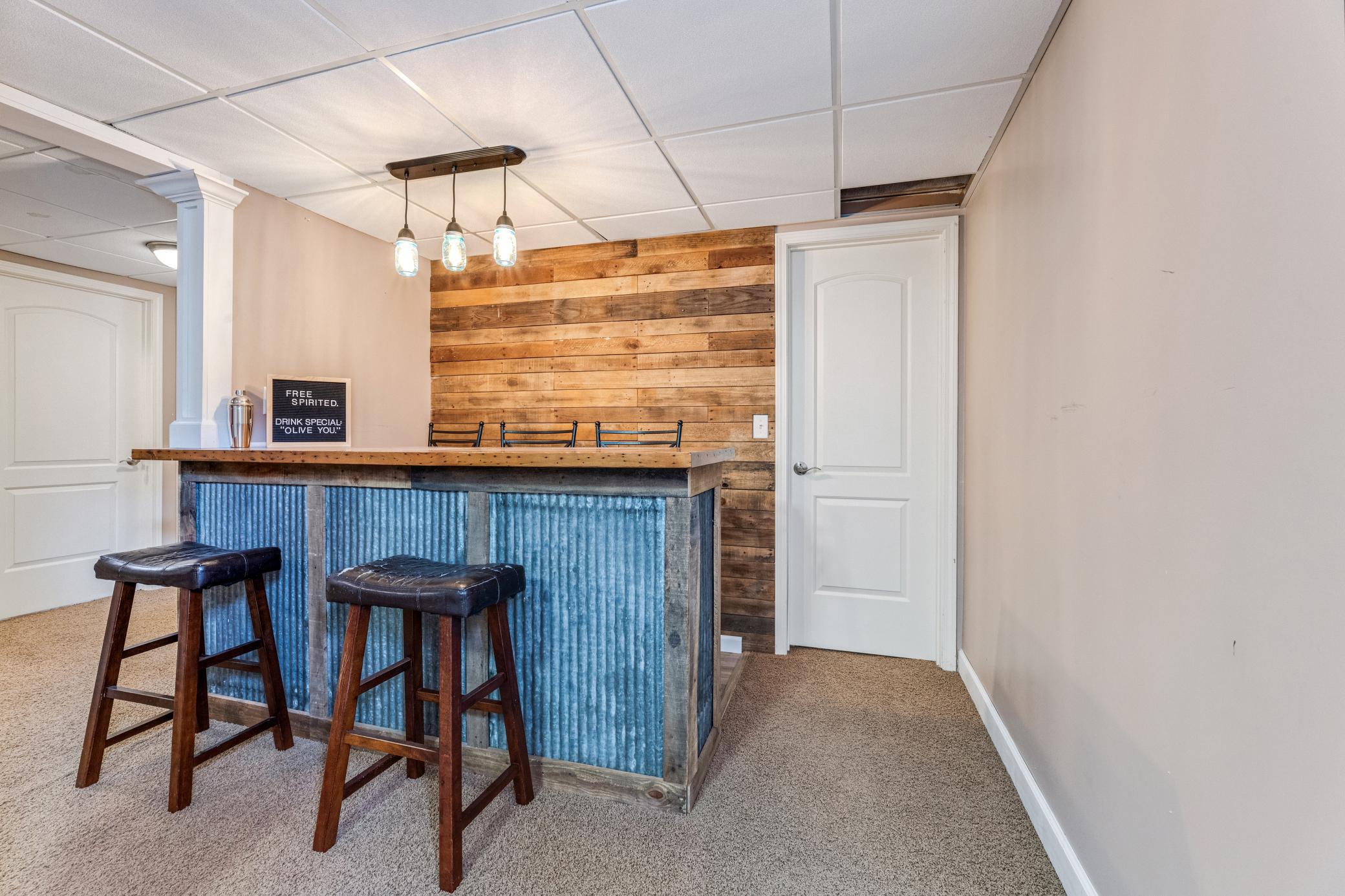 Finished lower level with a bar area