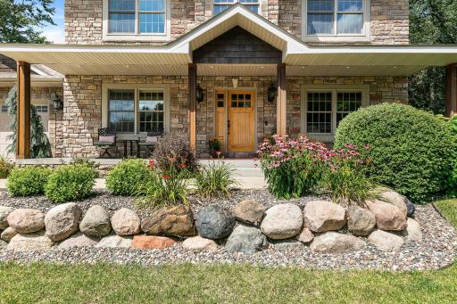 Beautifully landscaped front yard with vibrant flowers.