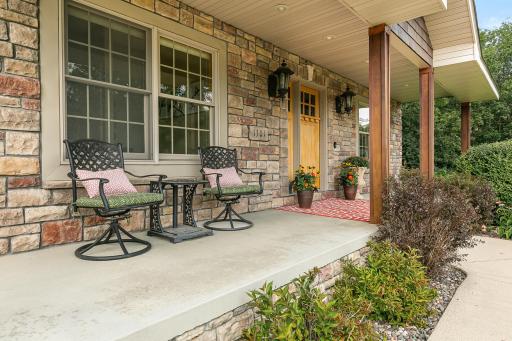 Inviting covered front porch to relax at.