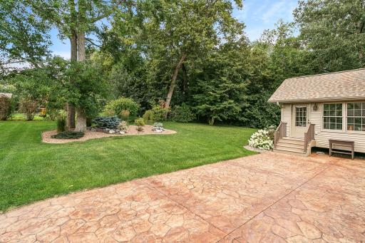Mature lot, views from 4 season sunroom and huge patio.