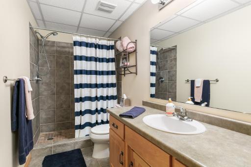 3/4 bathroom in the basement, beautifully tiled shower.