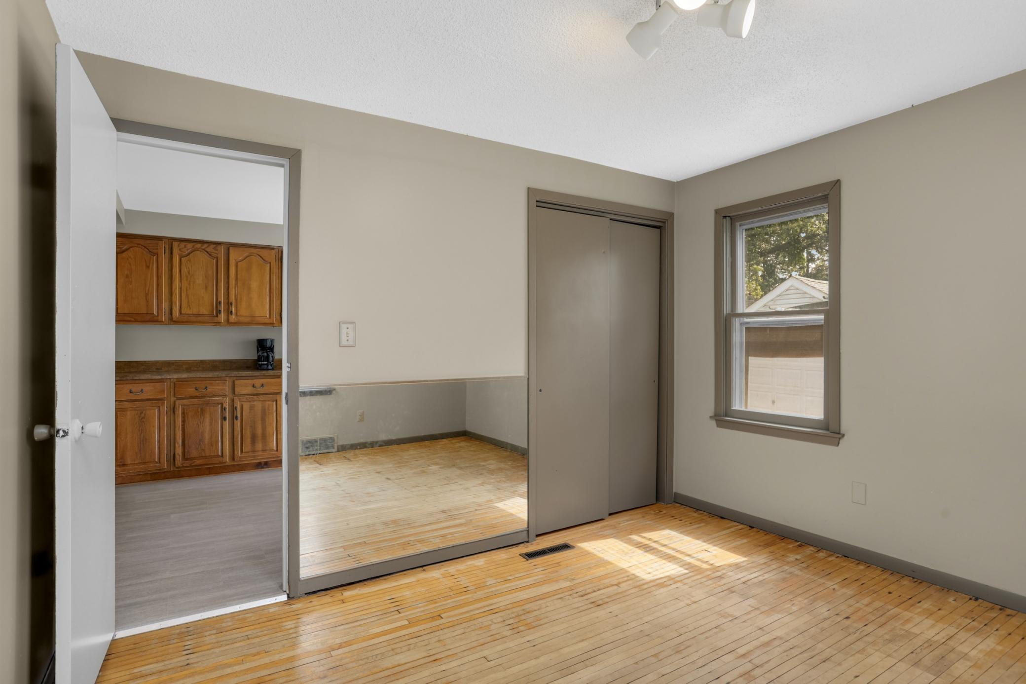 Main floor bedroom and closet.