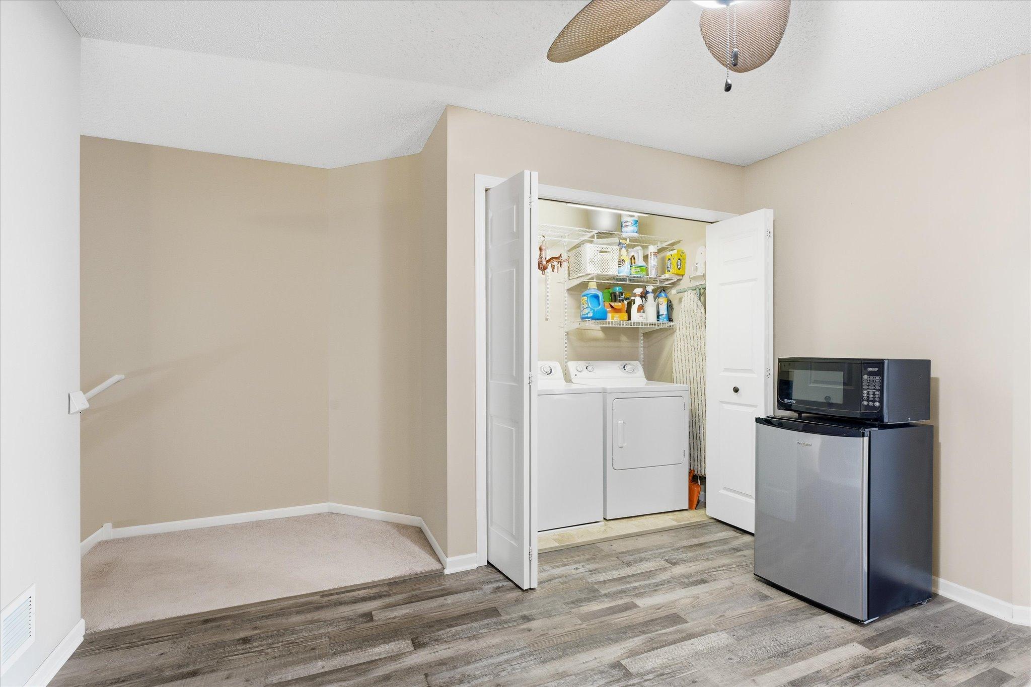 Flexible upper-level nook adjacent to the laundry area, perfect for additional storage, hobby space, or a small workstation.