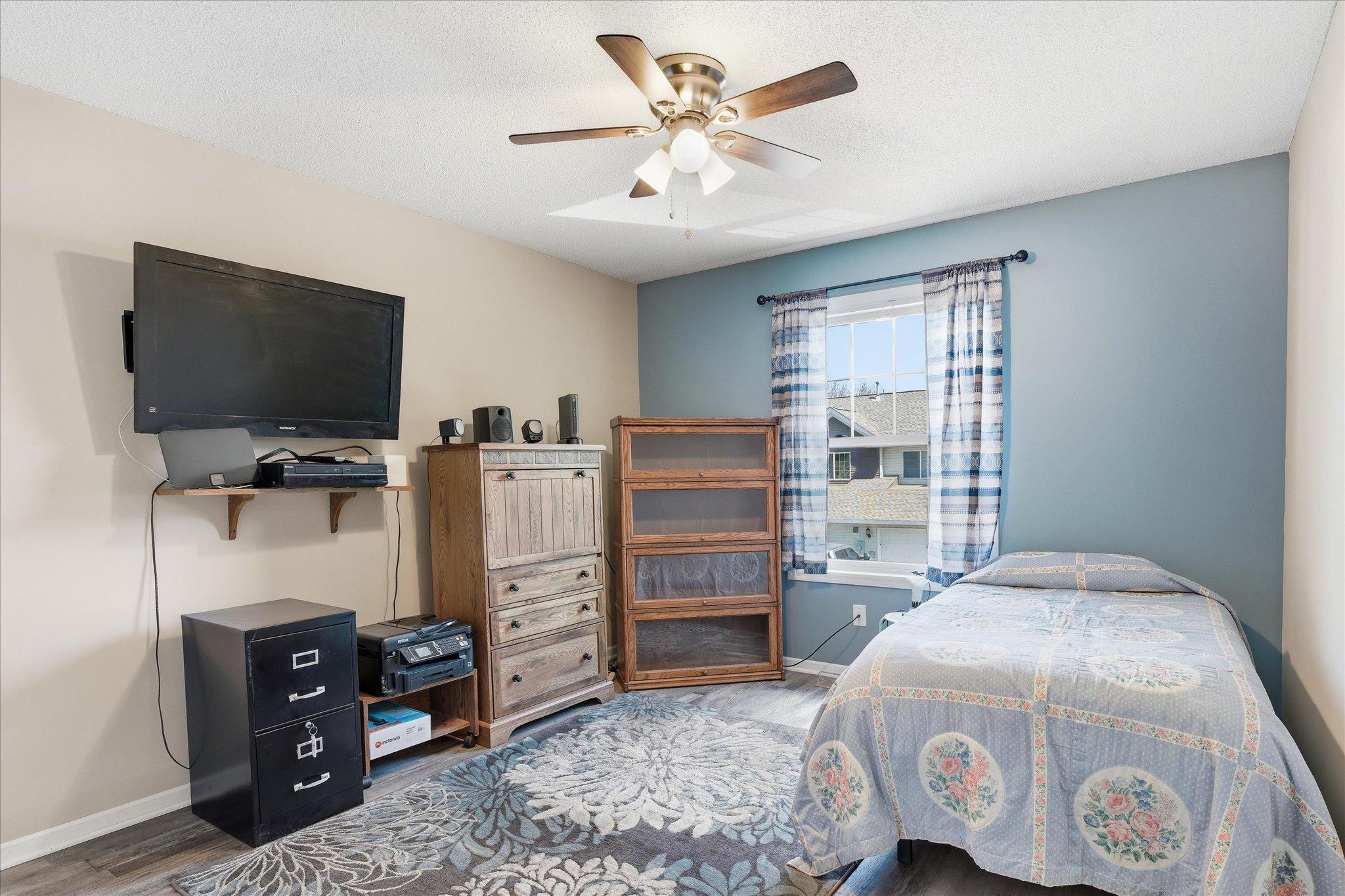 Bedroom #2 with updated flooring, generous natural light, and versatile space for guests, office, or hobbies.