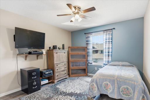 Bedroom #2 with updated flooring, generous natural light, and versatile space for guests, office, or hobbies.