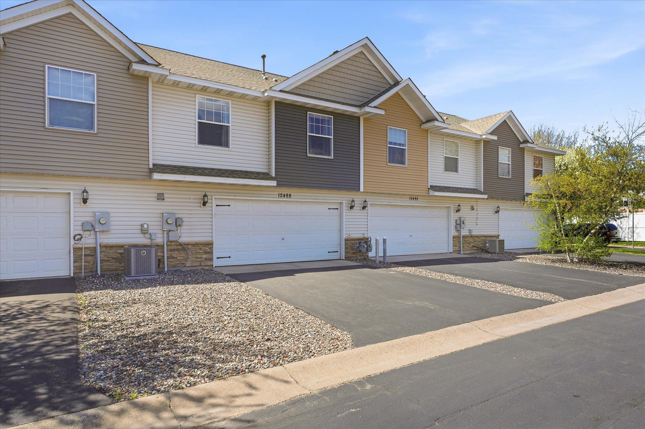 Oversized 2-car garage offers excellent storage with built-in shelving and convenient screen door entry into the home.