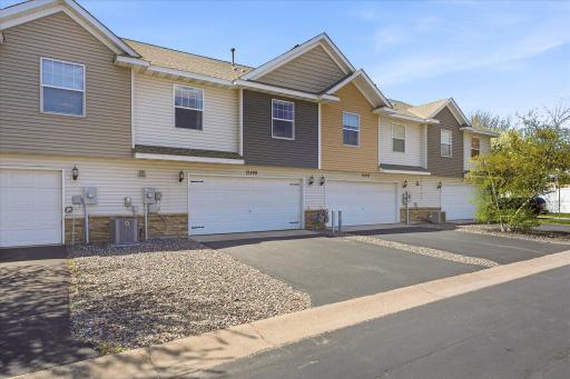Oversized 2-car garage offers excellent storage with built-in shelving and convenient screen door entry into the home.