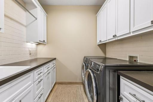 The lower level Laundry Room is conveniently located for the lower level bedrooms and pool for all those pool and lake towels.