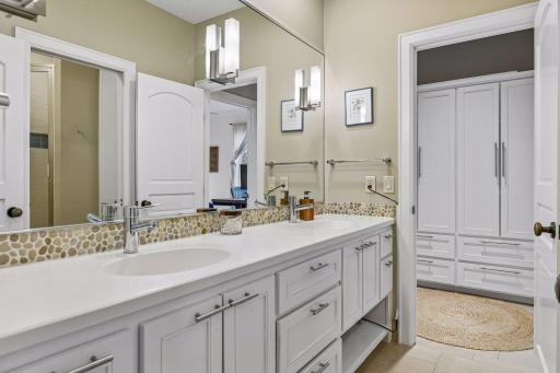 Two of the bedrooms share a 3/4 walk-through bathroom with furniture-style vanity.