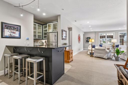 Stock the wet bar with your favorite beverages and snacks - the bar offers a full-size refrigerator and dishwasher.
