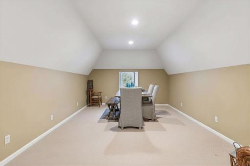 Across the hall from the Guest Suite is a spacious Bonus Room - ideal for a craft or hobby room with space to spread out!