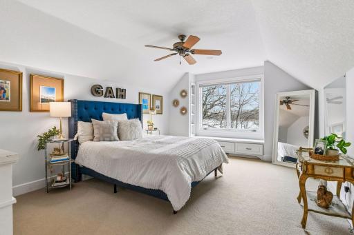 A private Bedroom Suite is tucked away on the upper level and enjoys long lake views and a spacious walk-in closet.