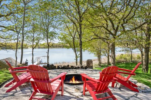 Enjoy the stunning custom landscaping complete with flagstone paver patios.