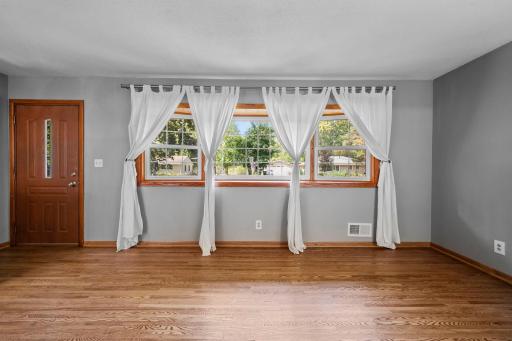 The Living Room boasts a bow window to bring in the sunlight