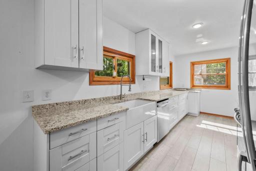 Chefs will love the nicely updated and fully equipped kitchen featuring a full complement of Stainless Steel appliances, tons of cabinetry with full length uppers and ample solid surface counter tops!