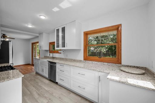 Chefs will love the nicely updated and fully equipped kitchen featuring a full complement of Stainless Steel appliances, tons of cabinetry with full length uppers and ample solid surface counter tops!