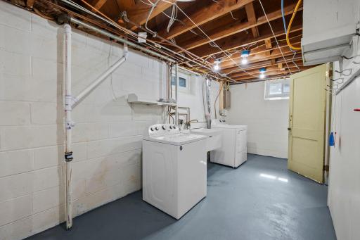 The Laundry/Utility room offers tons of storage possibilities