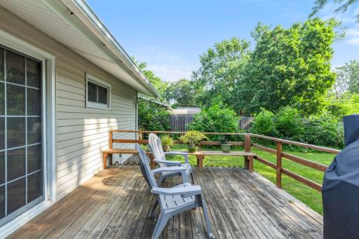 The nice 0deck overlooks the back yard