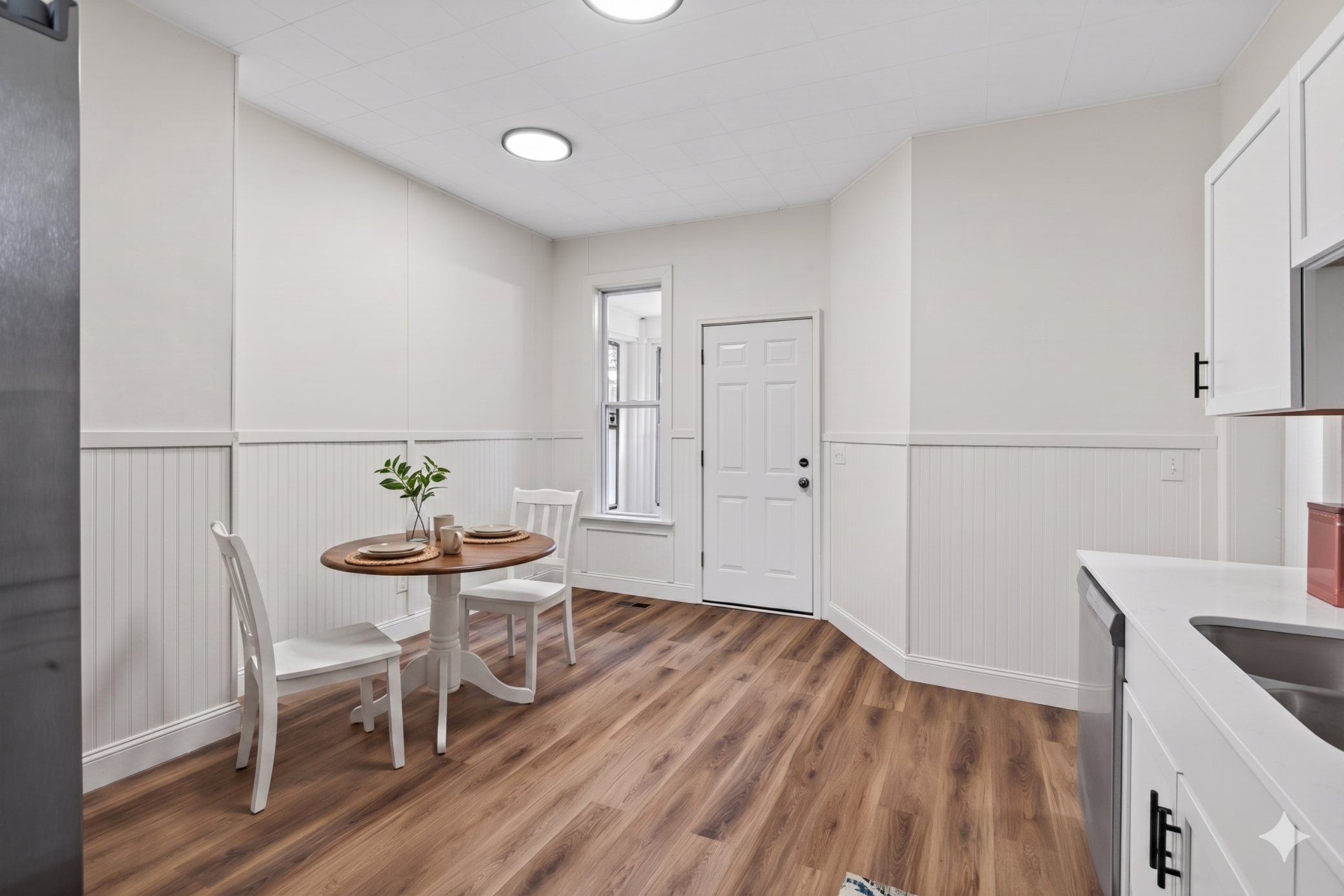 Informal dining in the kitchen, virtually staged
