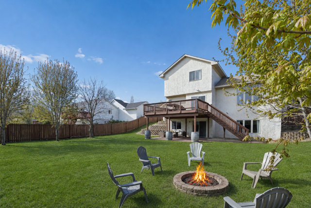 THIS! so much to love in one picture! large fenced yard and firepit area.... time to make some Smores!