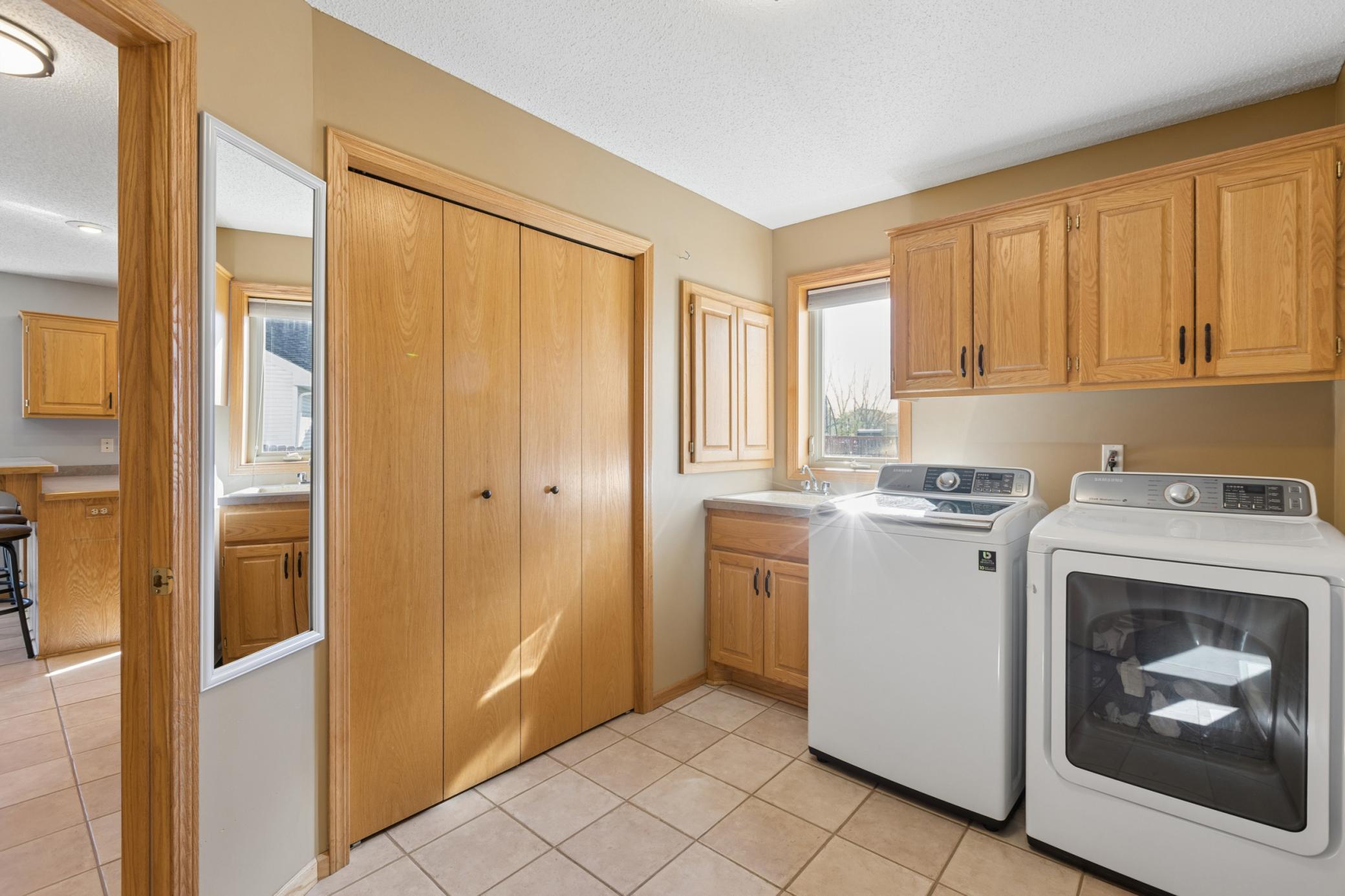 Main floor mud/laundry room, conveniently located off the kitchen w/ easy access to the garage! No more struggling carrying in groceries!