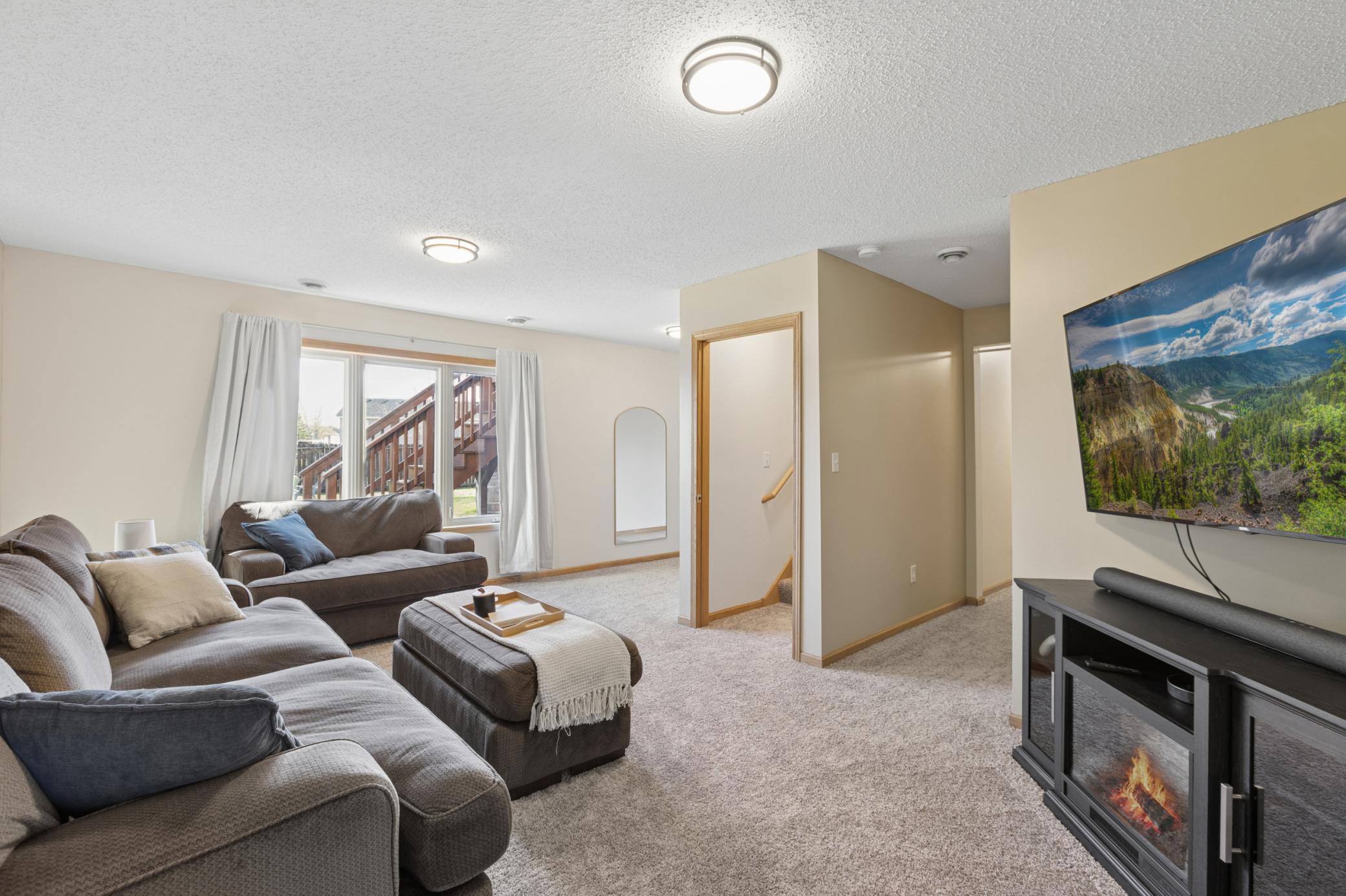 A second look at the family room.. you will enjoy this space for a cozy movie night or just hanging out!