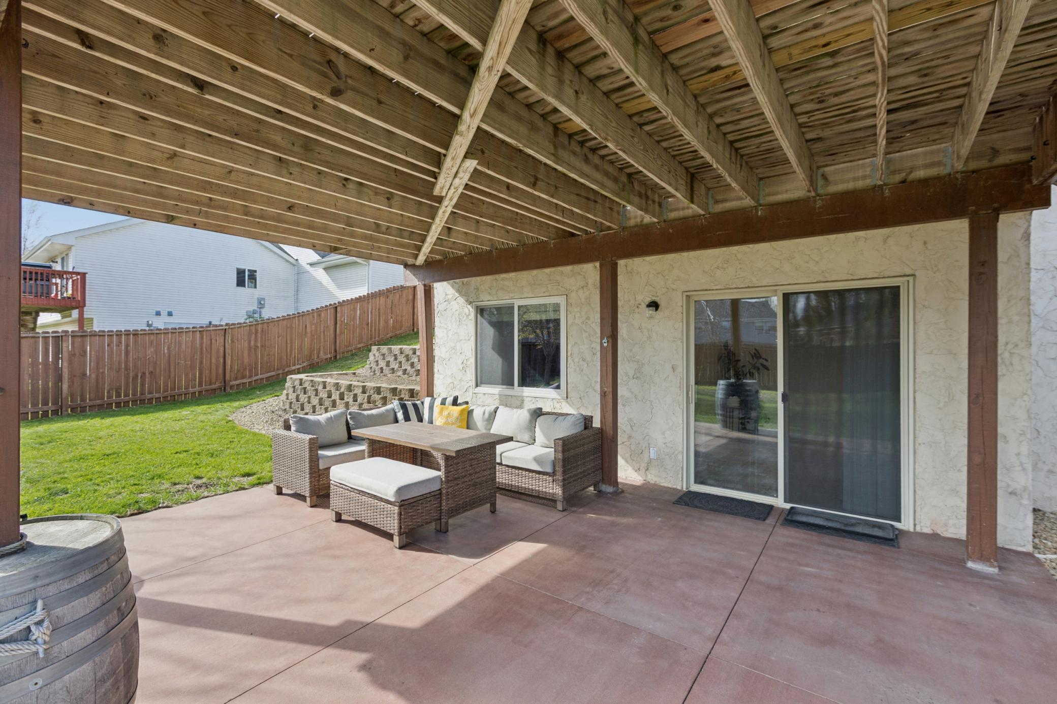 Large patio offers an extra space to enjoy the backyard... add some lights and you are set to enjoy MN summers here!